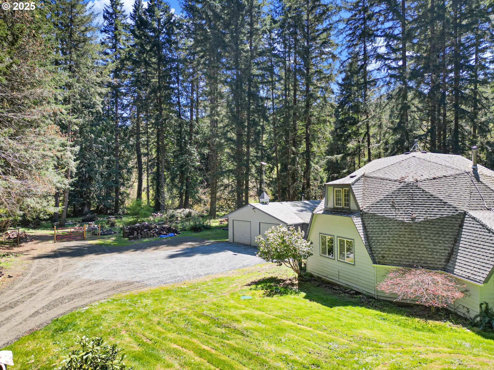 24458 Panther Creek Road Veneta, OR 97487 - Photo 2 of 46 a view of a backyard with a sink and a fire pit