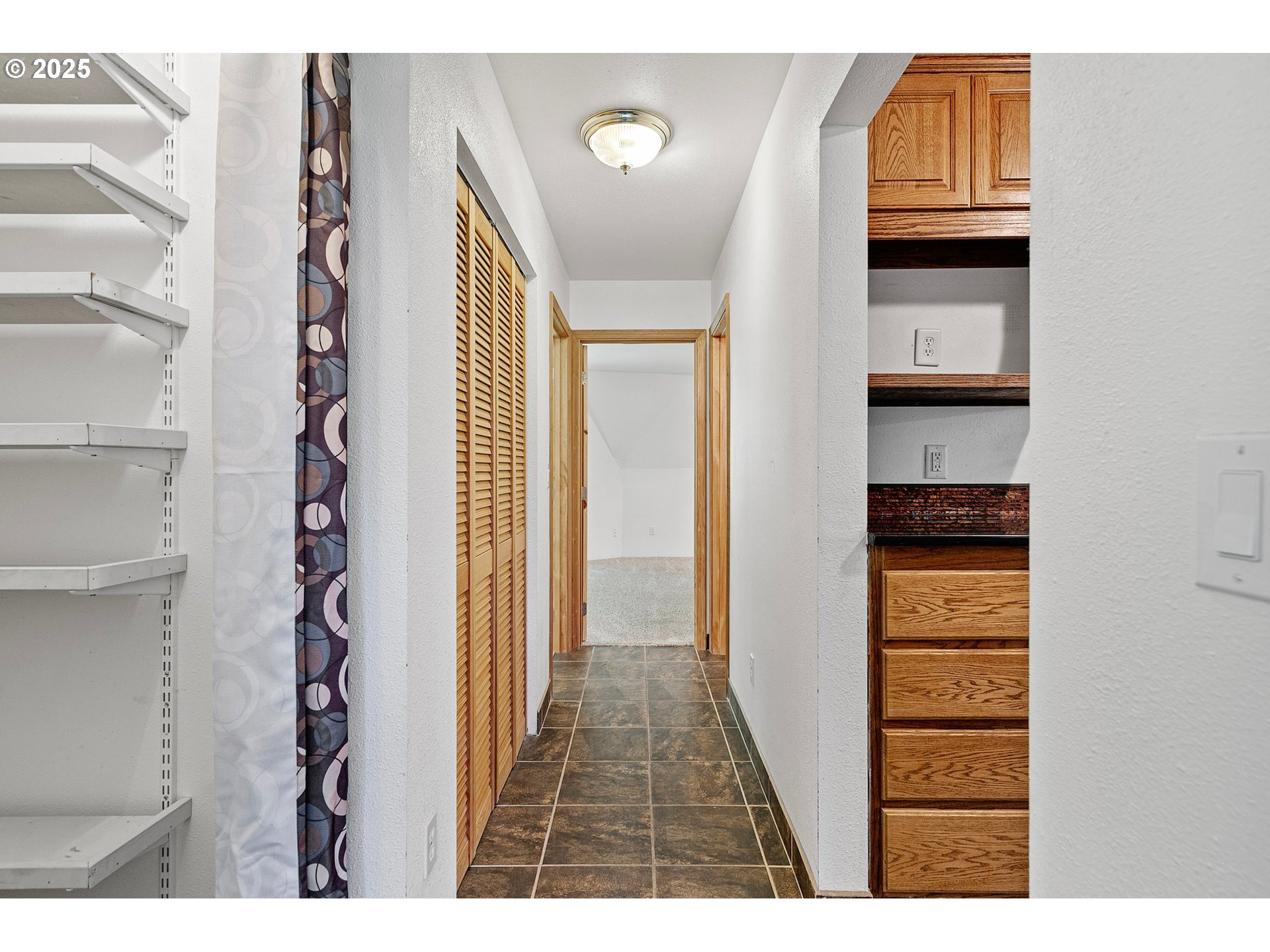 24458 Panther Creek Road Veneta, OR 97487 - Photo 23 of 46 a view of hallway with stairs and wooden floor