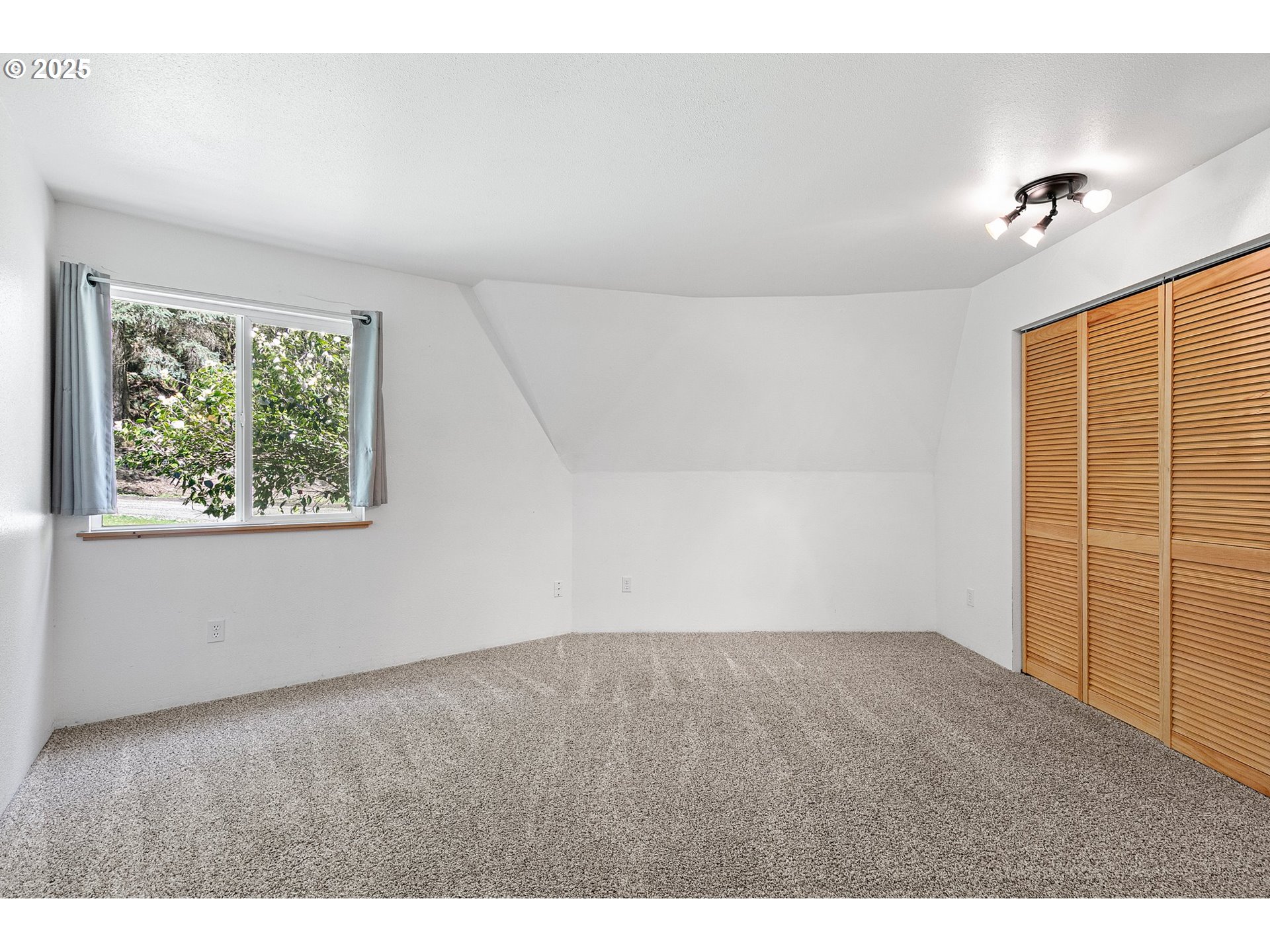 24458 Panther Creek Road Veneta, OR 97487 - Photo 26 of 46 a view of an empty room with a window