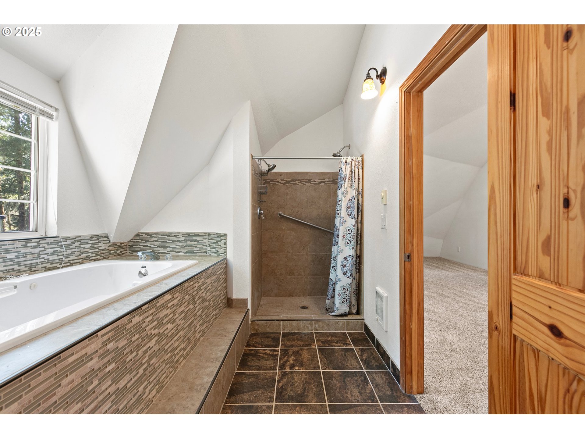 24458 Panther Creek Road Veneta, OR 97487 - Photo 32 of 46 a bathroom with a vanity and a bathtub