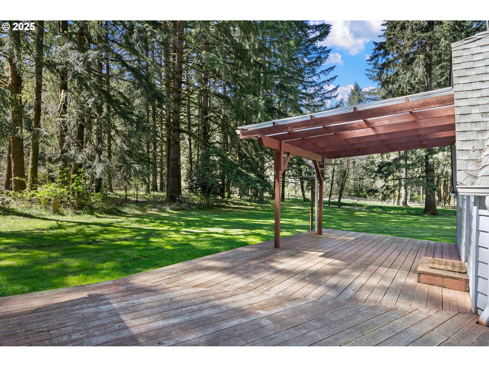 24458 Panther Creek Road Veneta, OR 97487 - Photo 33 of 46 a view of a backyard with a small cabin