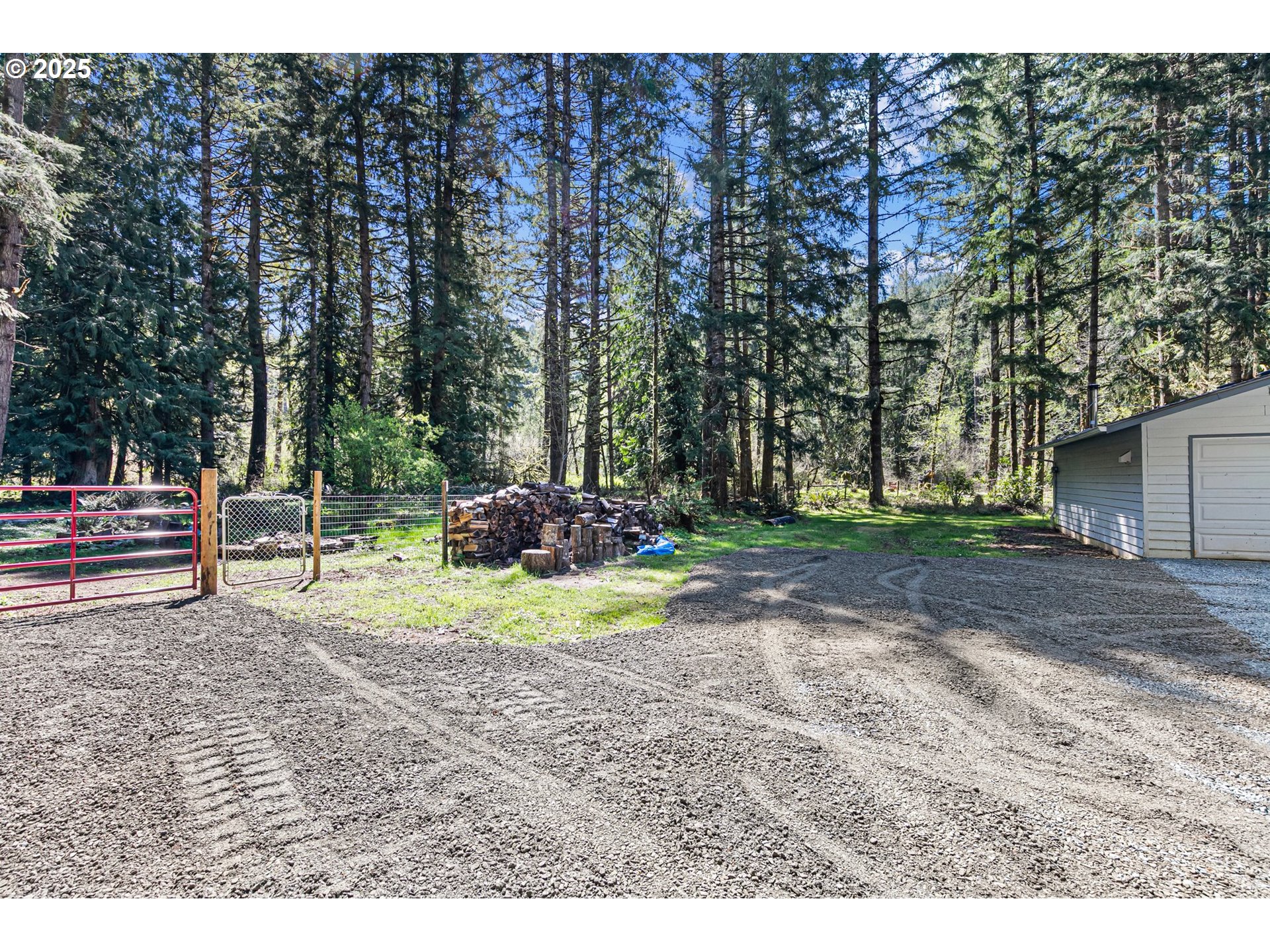 24458 Panther Creek Road Veneta, OR 97487 - Photo 38 of 46 a backyard of a house with a yard and outdoor seating
