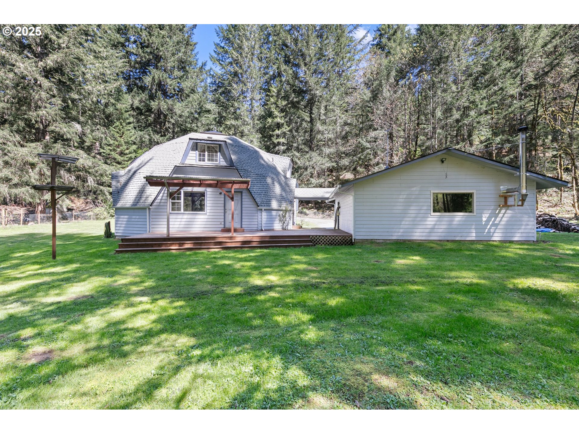 24458 Panther Creek Road Veneta, OR 97487 - Photo 10 of 46 a front view of house with yard and trees in the background