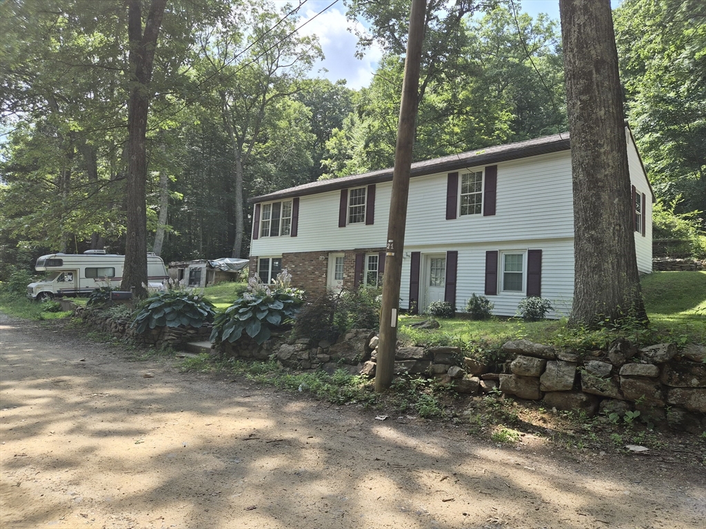 124 Old County Road Holland, MA 01521 - Photo 31 of 31 a view of a house with a yard