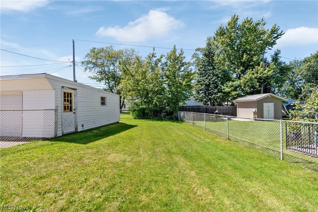 1722 Chelmsford Road Cleveland, OH 44124 - Photo 26 of 34 View of yard with a storage unit