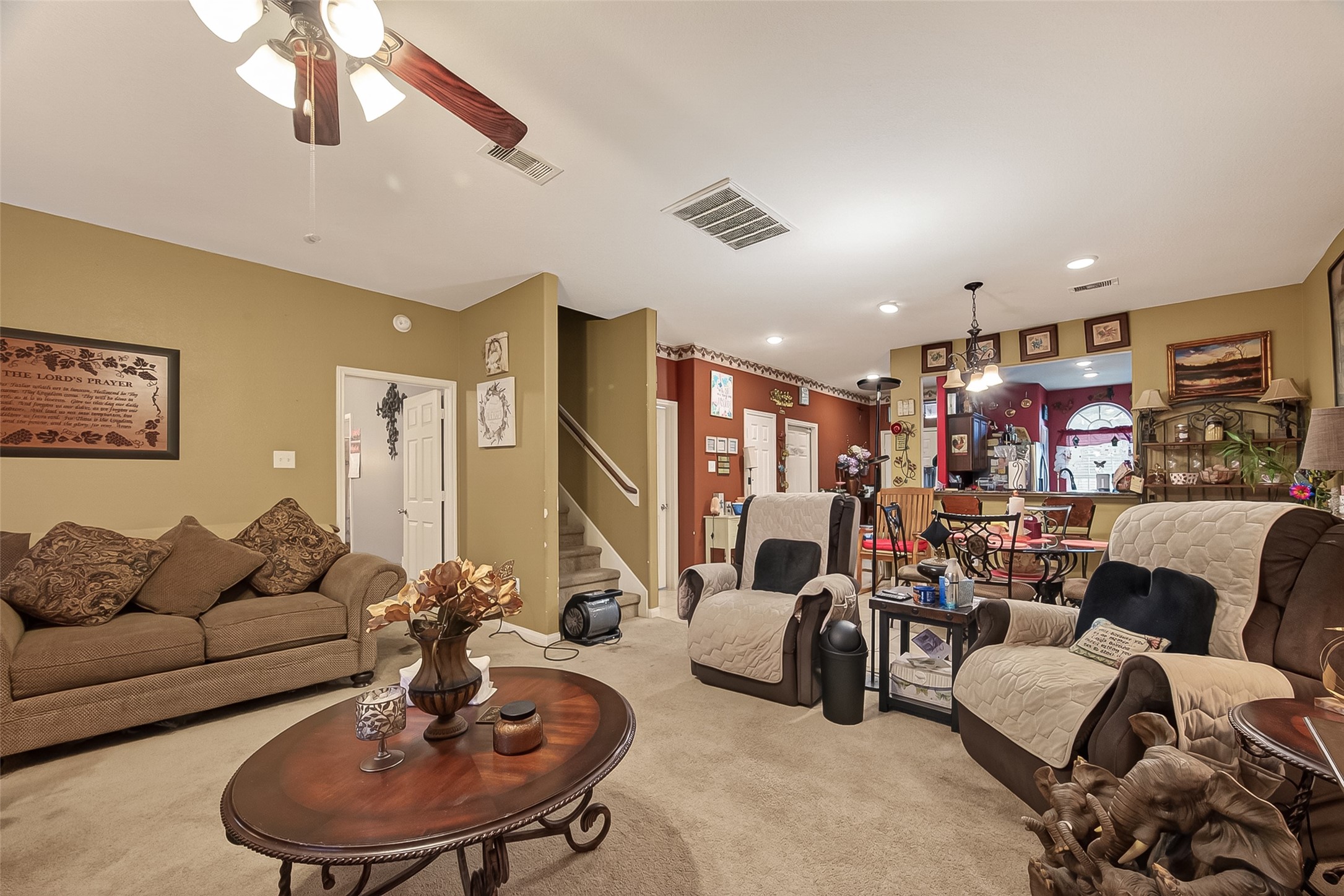1019 Arnica Street Baytown, TX 77521 - Photo 6 of 16 a living room with furniture kitchen and a chandelier