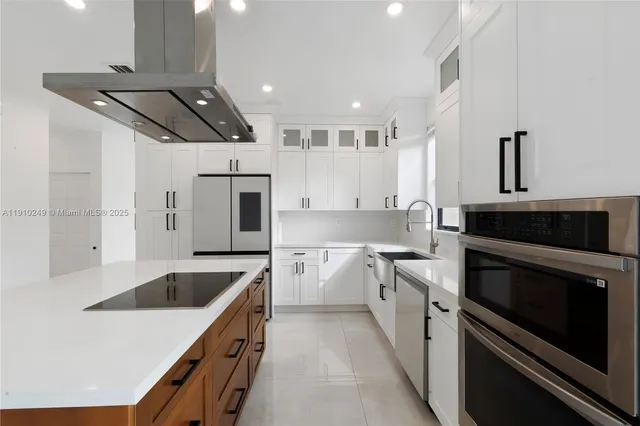 a kitchen with a sink stove and refrigerator