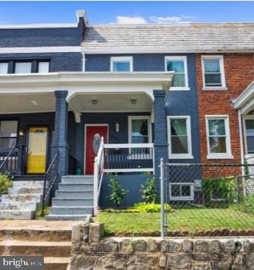 Charming row home with vibrant accents.