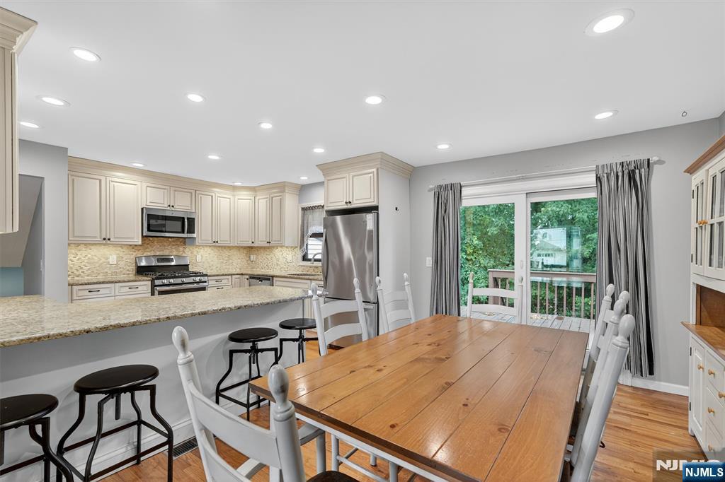 7 Faber Place Nutley, NJ 07110 - Photo 14 of 41 a kitchen with stainless steel appliances granite countertop a refrigerator sink and cabinets