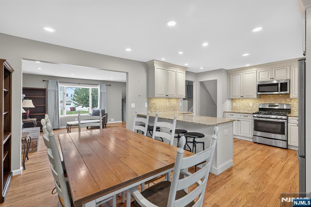 7 Faber Place Nutley, NJ 07110 - Photo 15 of 41 a large kitchen with kitchen island a large island in the center