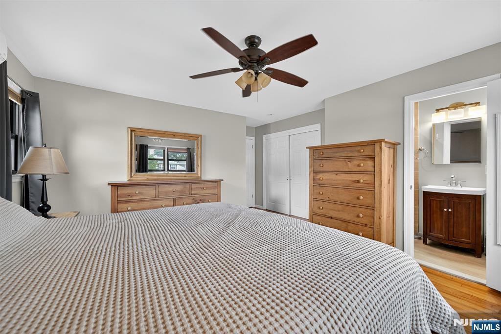 7 Faber Place Nutley, NJ 07110 - Photo 17 of 41 a bedroom with a bed and a chandelier