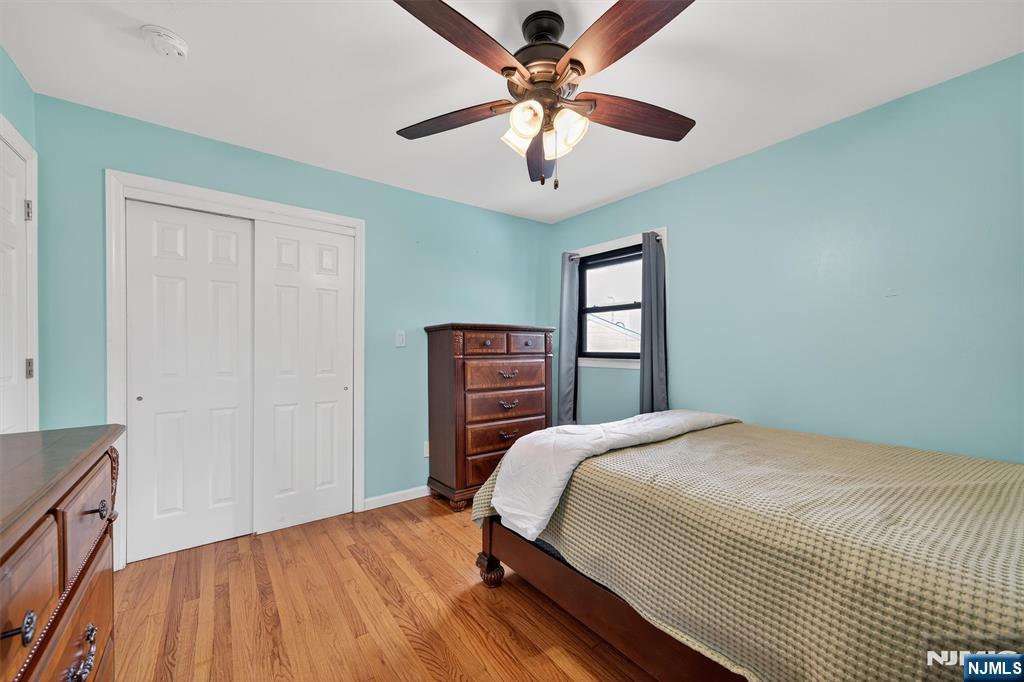 7 Faber Place Nutley, NJ 07110 - Photo 23 of 41 a bedroom with a bed and a chandelier