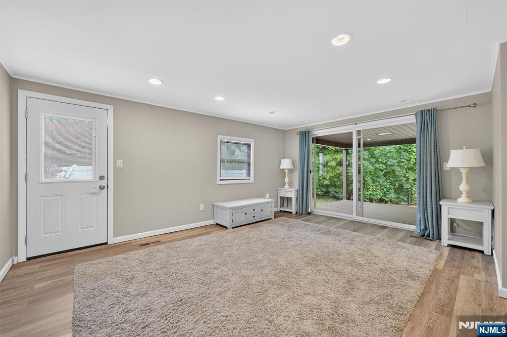 7 Faber Place Nutley, NJ 07110 - Photo 25 of 41 a view of an empty room with a window and wooden floor
