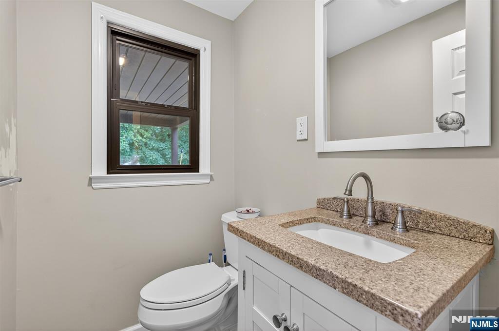 7 Faber Place Nutley, NJ 07110 - Photo 26 of 41 a bathroom with a granite countertop toilet sink and mirror