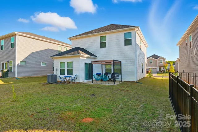 a front view of house with yard and outdoor seating