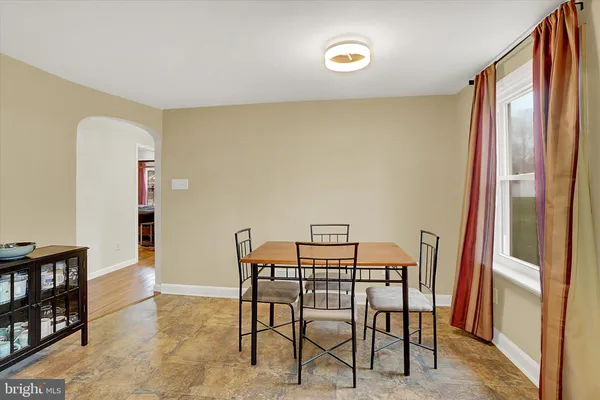 a view of a room with furniture and window