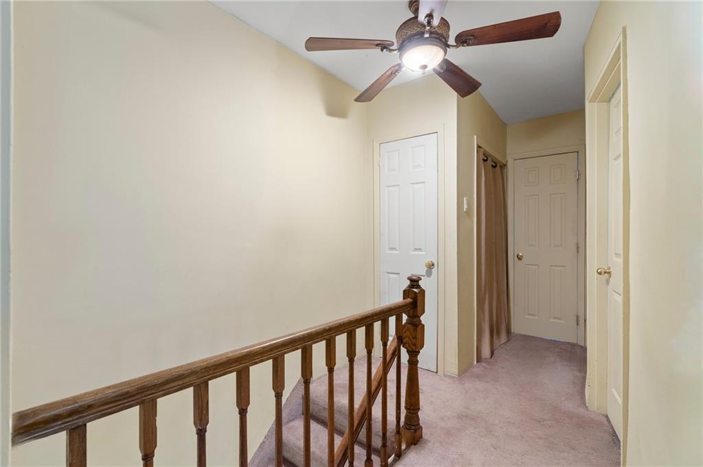 2472 Stuart Street Brooklyn, NY 11229 - Photo 13 of 28 a view of a hallway with a chandelier fan