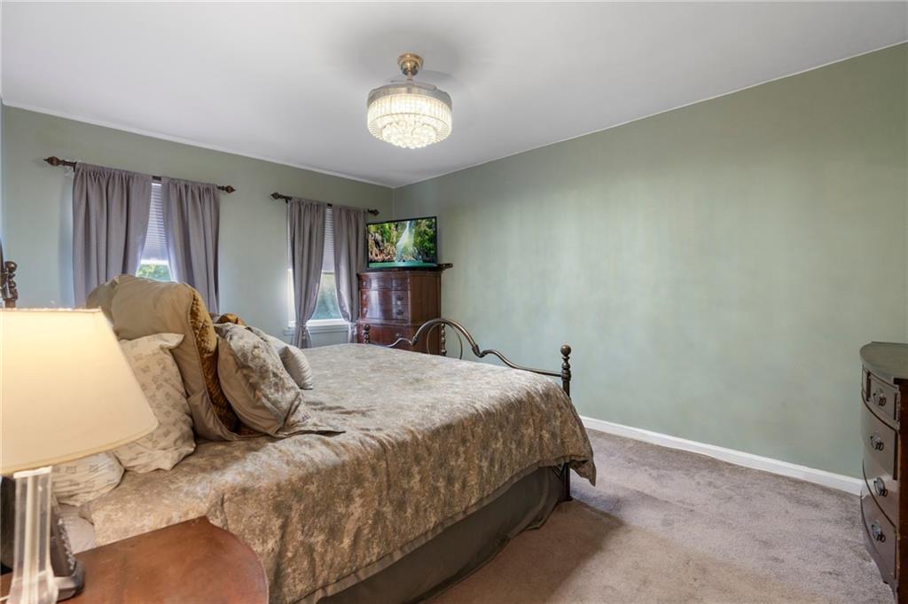 2472 Stuart Street Brooklyn, NY 11229 - Photo 16 of 28 a bed sitting in a spacious bedroom next to a window