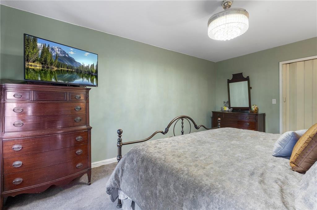 2472 Stuart Street Brooklyn, NY 11229 - Photo 18 of 28 a bedroom with a bed and a flat screen tv
