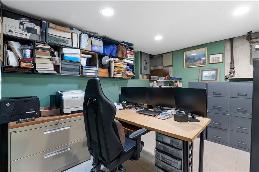 2472 Stuart Street Brooklyn, NY 11229 - Photo 24 of 28 a work place with furniture and a bookshelf