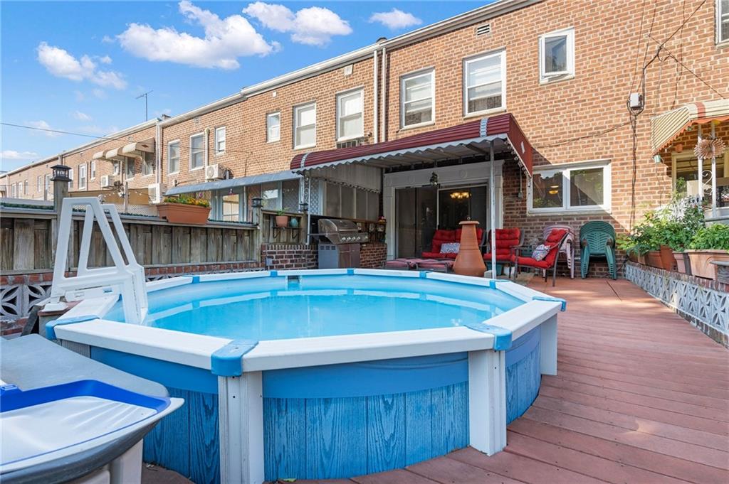 2472 Stuart Street Brooklyn, NY 11229 - Photo 26 of 28 a view of a house with swimming pool and sitting area