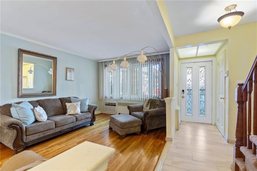 2472 Stuart Street Brooklyn, NY 11229 - Photo 4 of 28 a living room with furniture and a couch