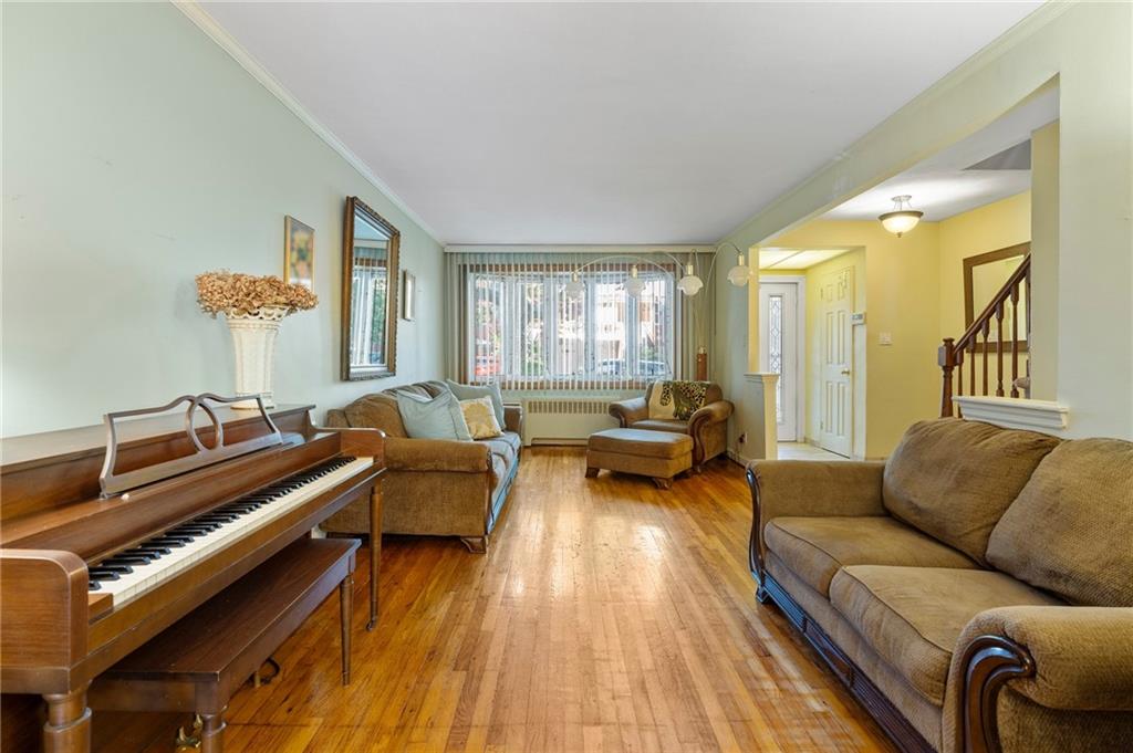 2472 Stuart Street Brooklyn, NY 11229 - Photo 5 of 28 a living room with furniture and a wooden floor
