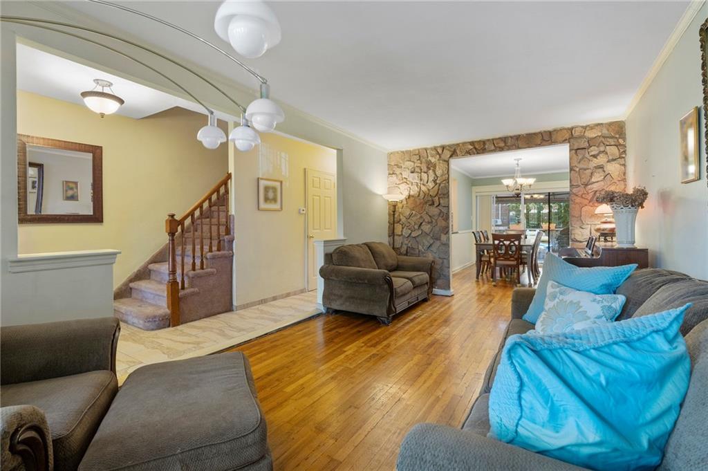 2472 Stuart Street Brooklyn, NY 11229 - Photo 6 of 28 a living room with furniture and a wooden floor