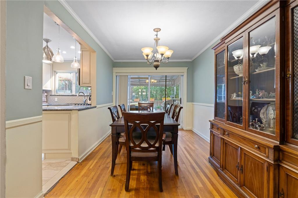 2472 Stuart Street Brooklyn, NY 11229 - Photo 7 of 28 a view of a dining room with furniture window and wooden floor