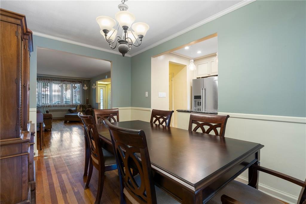 2472 Stuart Street Brooklyn, NY 11229 - Photo 8 of 28 a view of a dining room with furniture and wooden floor
