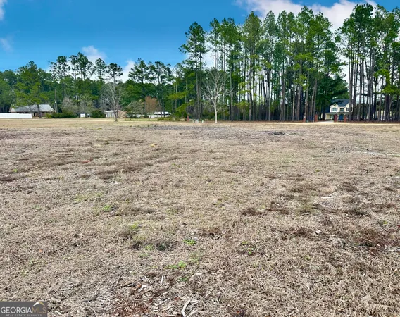 a white house with a yard