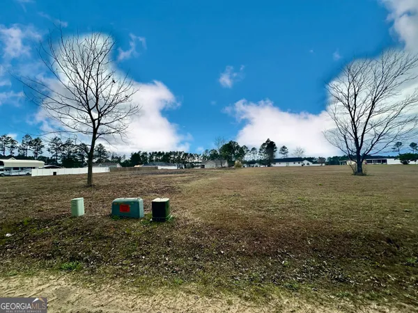 a view of a lake with a yard