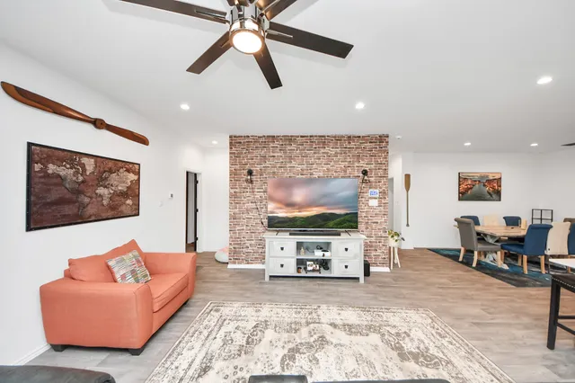 a living room with furniture and a flat screen tv