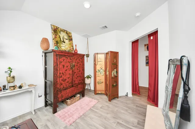 a view of a room with furniture and closet