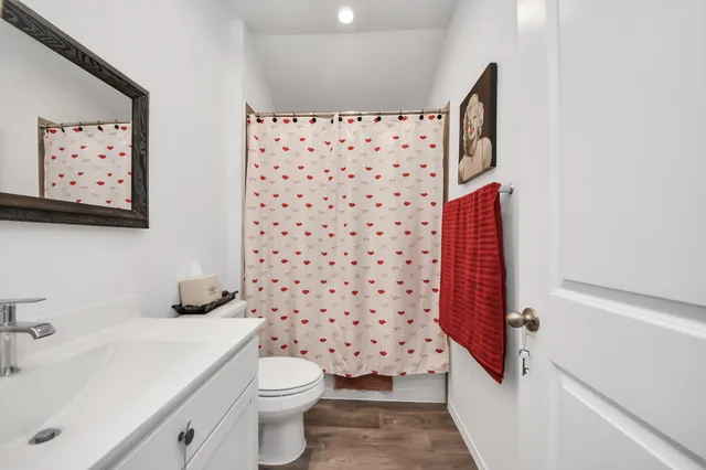 a bathroom with a toilet and a sink