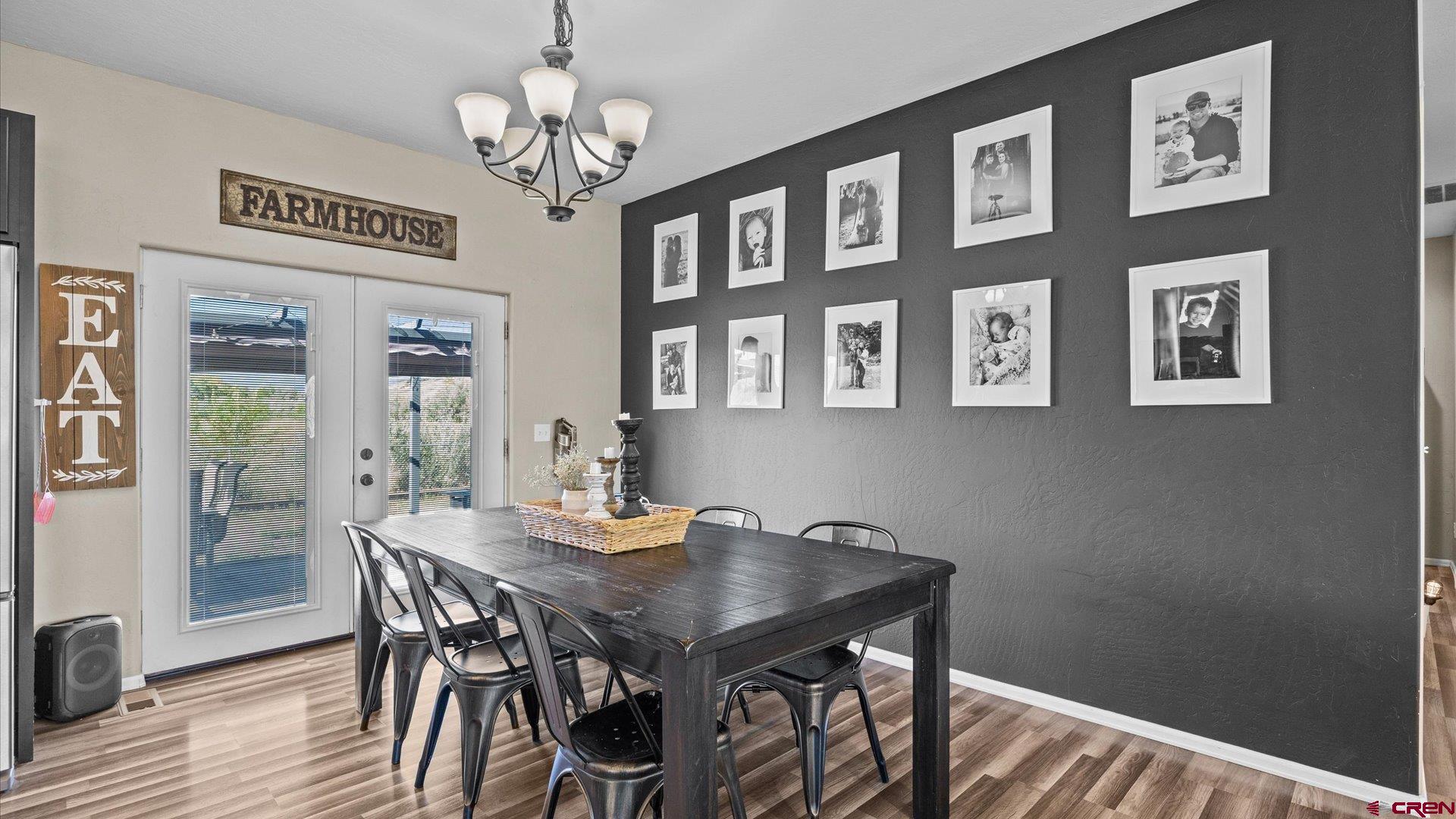 21017 Austin Road Austin, CO 81410 - Photo 11 of 29 a view of a dining room with furniture and chandelier