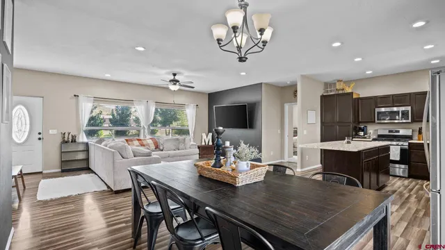 a view of a dining room with furniture window and outside view