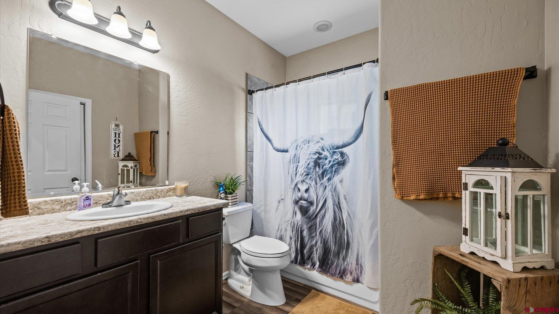 21017 Austin Road Austin, CO 81410 - Photo 21 of 29 a bathroom with a sink a toilet and shower