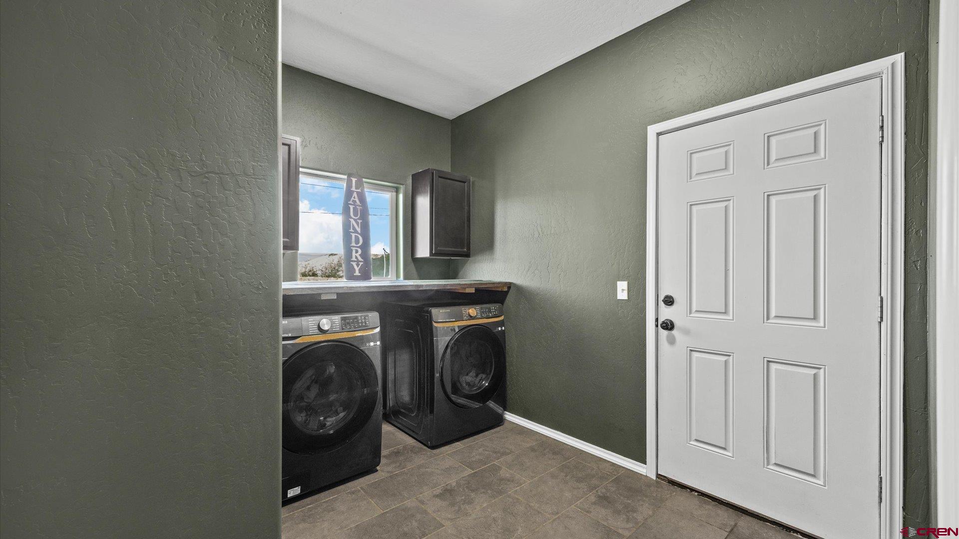 21017 Austin Road Austin, CO 81410 - Photo 22 of 29 a utility room with dryer and washer