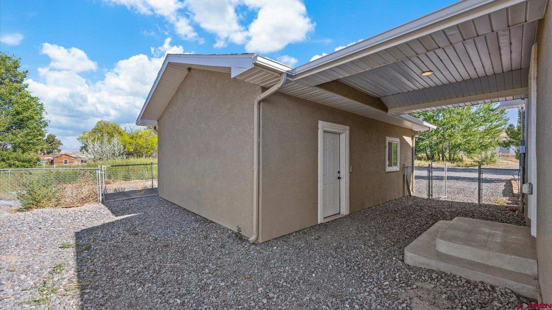 21017 Austin Road Austin, CO 81410 - Photo 23 of 29 a view of backyard with plants and outdoor seating