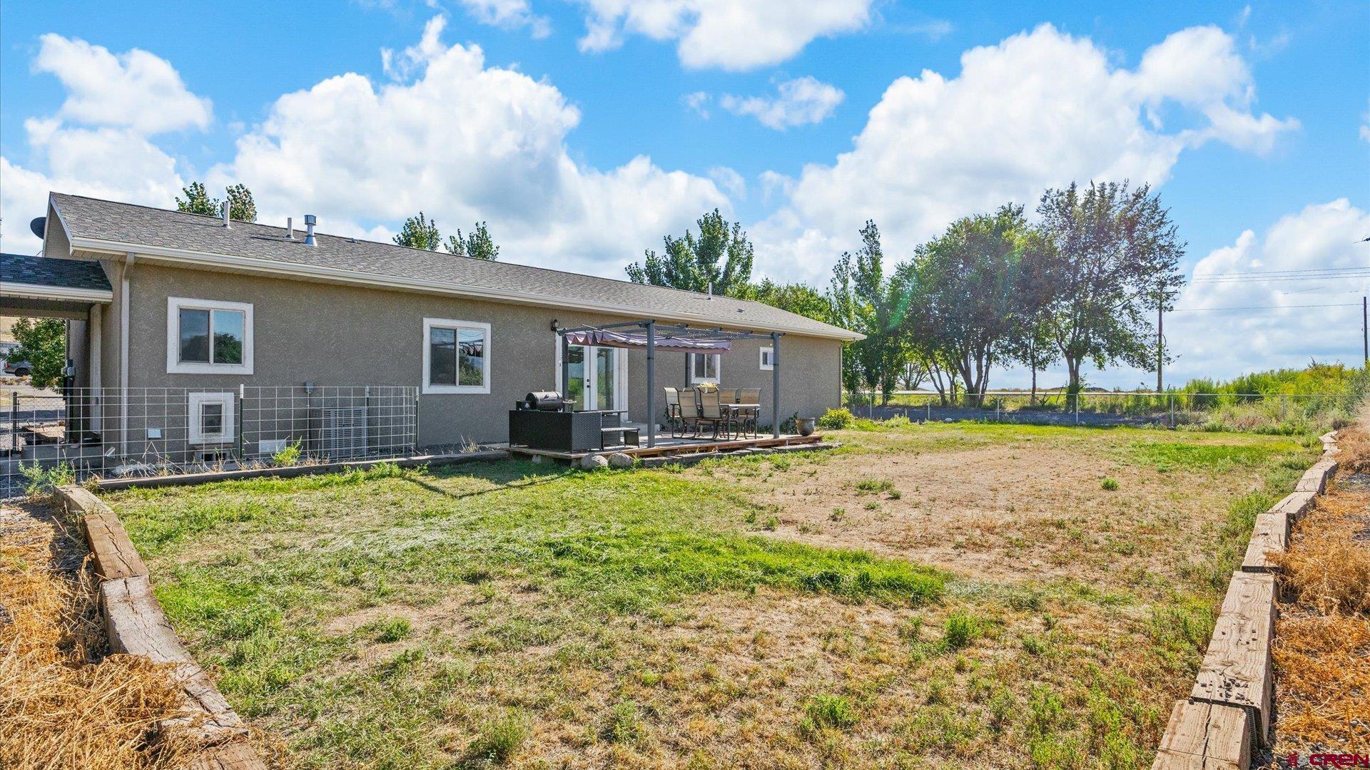 21017 Austin Road Austin, CO 81410 - Photo 24 of 29 a view of a house with a backyard