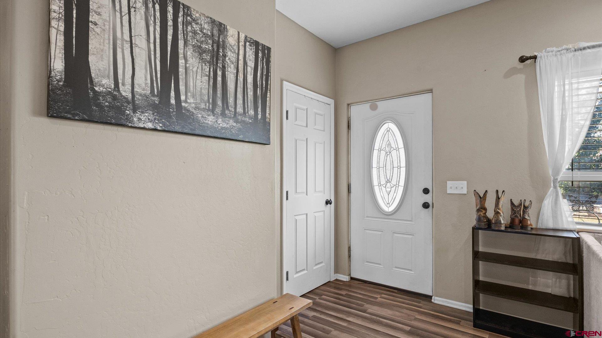 21017 Austin Road Austin, CO 81410 - Photo 6 of 29 a view of front door with wooden floor