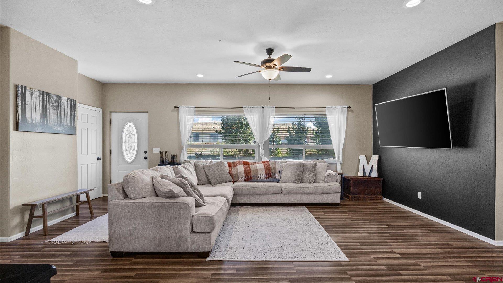 21017 Austin Road Austin, CO 81410 - Photo 7 of 29 a living room with furniture and a flat screen tv