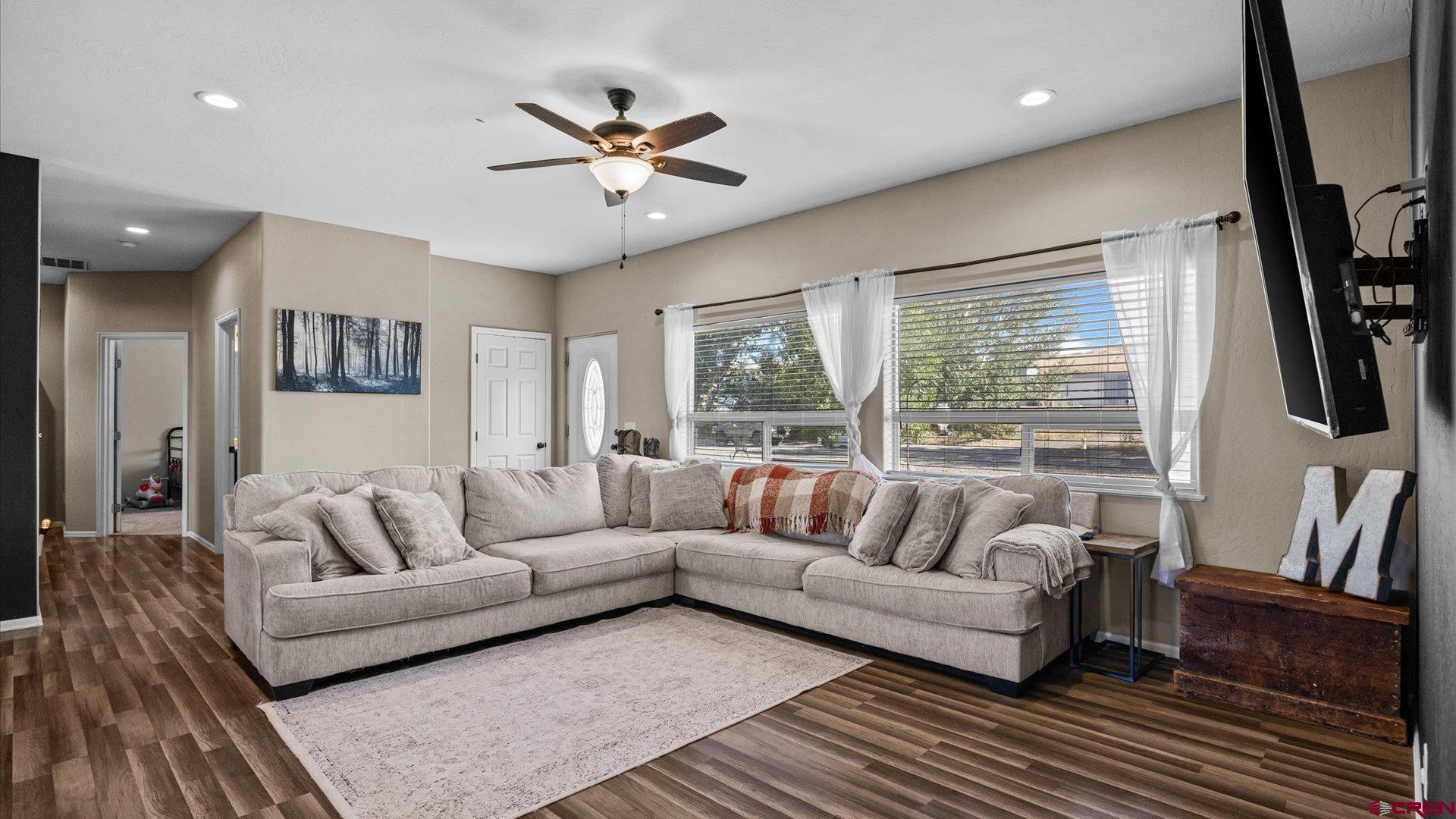 21017 Austin Road Austin, CO 81410 - Photo 8 of 29 a living room with furniture and a flat screen tv