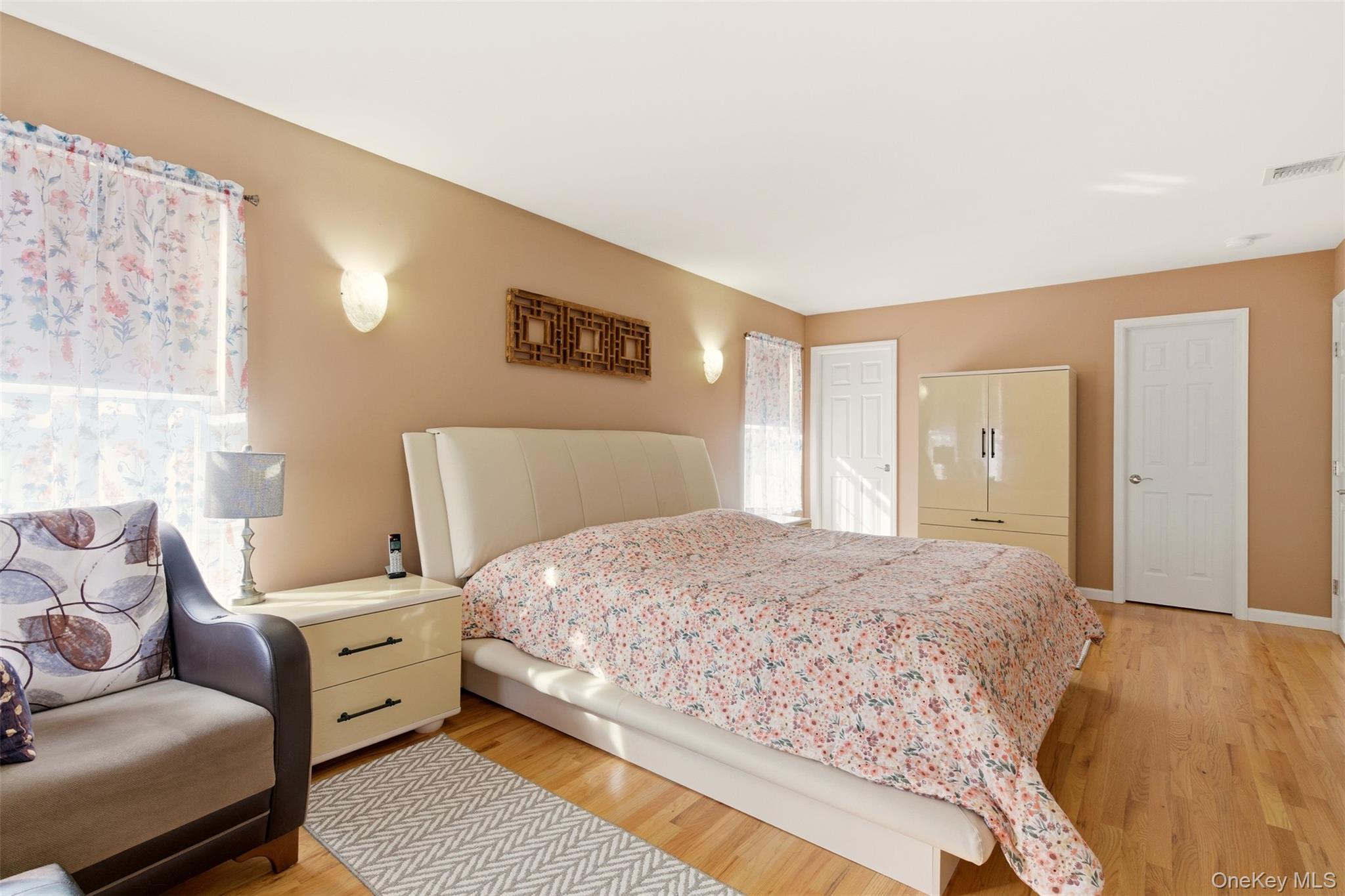 4 Macintosh Lane Selden, NY 11784 - Photo 11 of 30 a bedroom with a bed and a couch