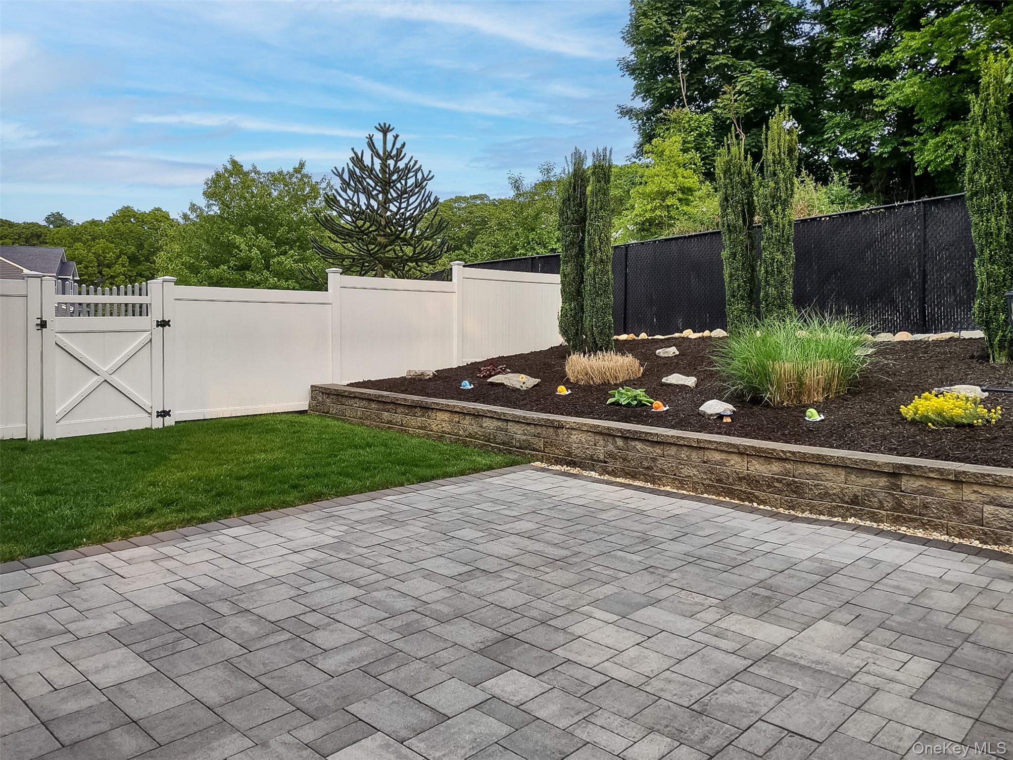 4 Macintosh Lane Selden, NY 11784 - Photo 19 of 30 a view of a backyard