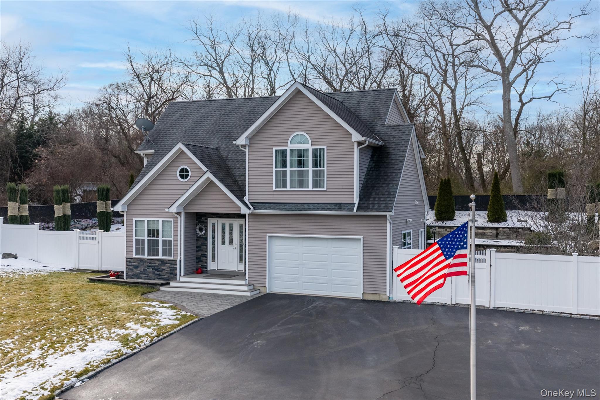 4 Macintosh Lane Selden, NY 11784 - Photo 2 of 30 a front view of a house with garage
