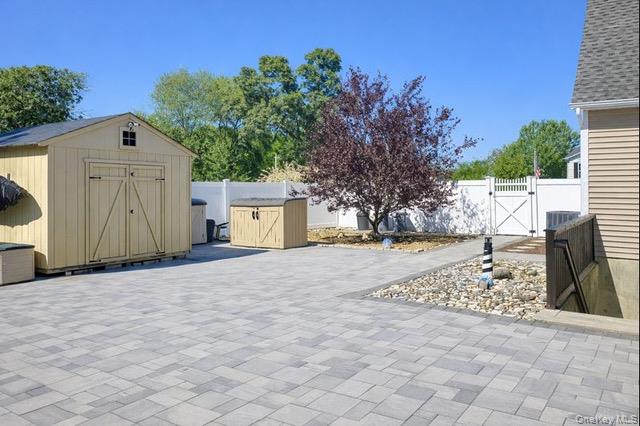 4 Macintosh Lane Selden, NY 11784 - Photo 20 of 30 a house with trees in front of it