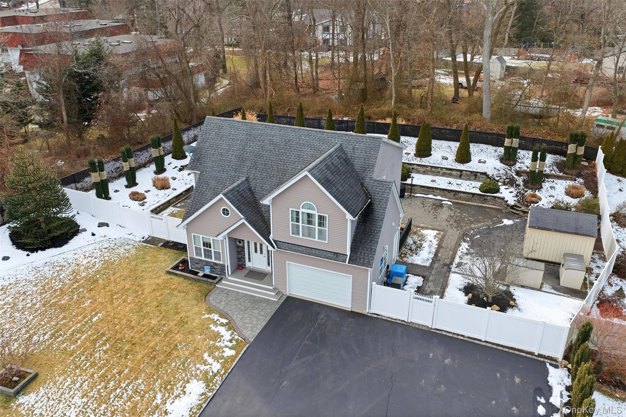 4 Macintosh Lane Selden, NY 11784 - Photo 21 of 30 an aerial view of a house with a yard