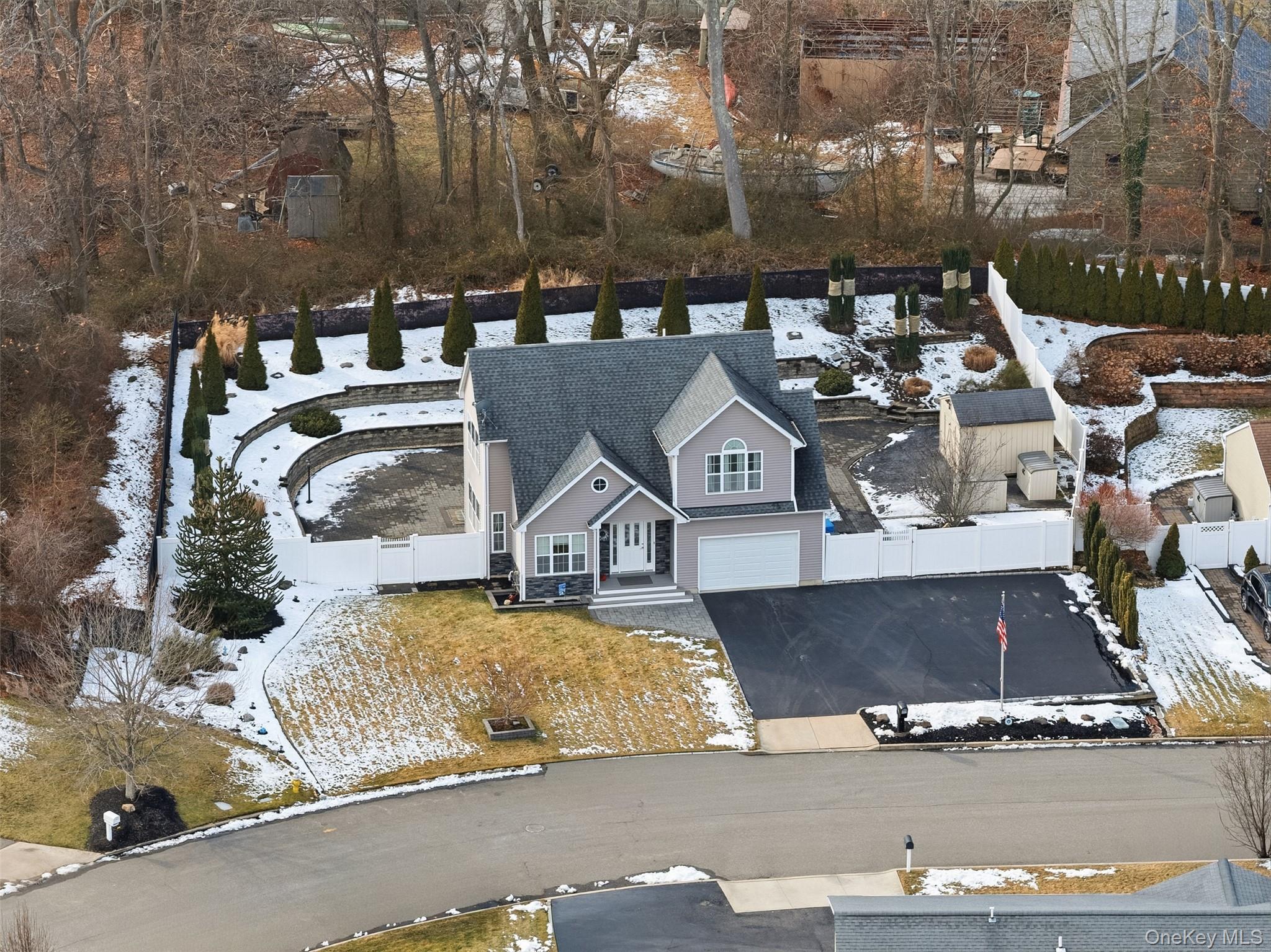 4 Macintosh Lane Selden, NY 11784 - Photo 22 of 30 a view of a house with outdoor space